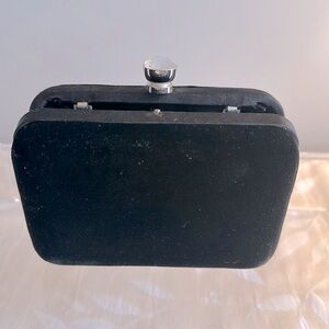 Adorable black velvet clutch with crystal snap closure.